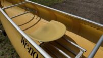 Wenonah Voyager - Aramid Ultralight, Silver Trim, Pedestal Seat, Footbrace - Factory Demo - Image 4