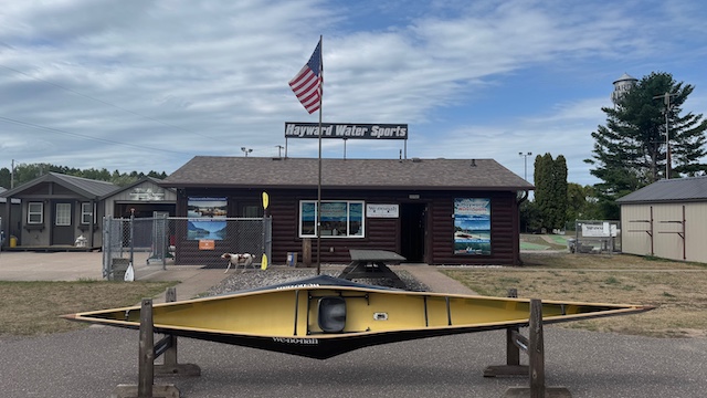 Wenonah J203 Racing Canoe - Graphite Ultra-Light - Wood Inwales w Black Accent, Center Bailer, Integrated Race Seat with Foot Brace - Blem - Image 3