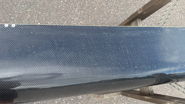 Wenonah J203 Racing Canoe - Graphite Ultra-Light - Wood Inwales w Black Accent, Center Bailer, Integrated Race Seat with Foot Brace - Blem - Image 11